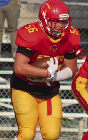 Titan Eighth Grader, Kash Smith, punched through the line for a one-yard touchdown, Thursday, at Girard. Columbus took a 32-20 win over the Trojans in the CCCJL contest.