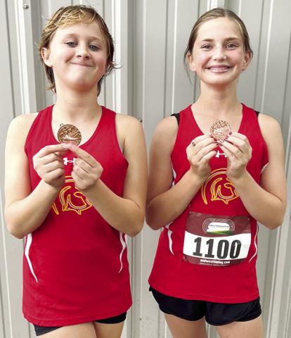 Hieyla Shelton placed tenth and Cora Rider was seventh for the Columbus Junior High Cross Country Team in the two mile, seventh grade, race at Humboldt, Tuesday. Courtesy photo.