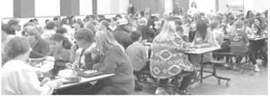 Guests join fifth graders for Thanksgiving lunch