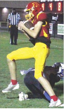 Titan Sophomore, Jonas Stover, came down with one of his three pass receptions in the end zone for the lone touchdown for Columbus in the 7-20 homecoming loss to Neodesha, Friday, at Titan Stadium. Senior, Jett Tanner, threw the pass from eight yards out.