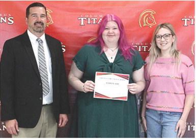 Ashlyn Ash received the Grundy Family Scholarship in the amount of $500 from new USD 493 Superintendent, Dan Grundy and his daughter and 2024 CUHS Graduate, Reese Grundy, during the 2025 Senior Assembly, May 16, at the Columbus Unified High School Gymnasium.