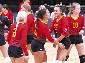 Katy Mooney and Katie Simpson celebrate after a point at the Frontenac Tournament recently.