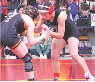 Lady Titan Hannah Noel, takes on an opponent during the recent Columbus Duals Tournament at the CUHS Gym. Hannah opened the season with a third place finish at the Kan-Okla Tourney and a win in the Bentonville West Tourney.
