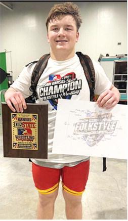 Columbus Wrestling Club’s 2026 USAWKS State 14U 235 Folkstyle Wrestling Champion, Cajen Smith, displays the plaque and bracket he earned at the tournament in Topeka, Saturday. Courtesy photo.