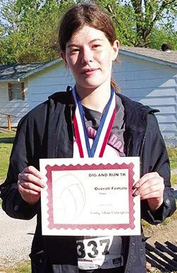 Katelyn Draeger won first place in the Lady Titan Volleyball Fundraiser 5K Run, April 20. Katelyn took first in the 14-18 age group and was the overall female racer with a time of 30.43 minutes. Courtesy photo.