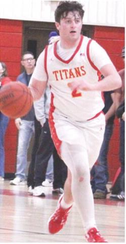 Titan Senior, Jett Tanner, brings the ball up court during the loss to Riverton, 49-55, Tuesday, at the CUHS Gym. Jett scored nine points in the loss for the Titans.