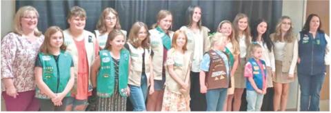 In September 2024, the Cherokee County Girl Scouts held a Bridging and Awards banquet honoring both girl scouts and adult volunteers. Girls Scouts from five Cherokee County Troops bridged up to the next level in Girl Scouts. Izabel Manus from Troop 70363 (third from left) received her Silver Award for her project of building a fire pit area at the Columbus Scout House. Courtesy photo.
