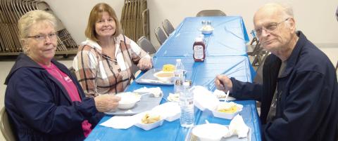 Clara White, Ralph White, and Regina Jameson enjoying lunch at the Columbus Lions Club Bean and Soup feed held March 5 at the St. Rose Parish Hall.