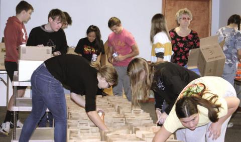 Community members, students assemble Thanksgiving food boxes