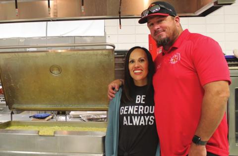 Leslie Minor and her husband, Columbus Firefighter, James Minor, help serve Chicken and Noodles at the Malachi Brown fundraiser in Baxter Springs. Over 700 meals were served.