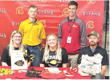 Lady Titan Senior, Emily Britt, signed a National Letter of Intent to continue her wrestling career with the Ottawa Lady Braves this fall. Emily was joined by her parents, Kimberly and Carl Britt and brother Carlson and Titan Head Wrestling Coach Marcus Bowman at her signing ceremony, Wednesday, at the Columbus Unified High School Gymnasium. Courtesy photo.