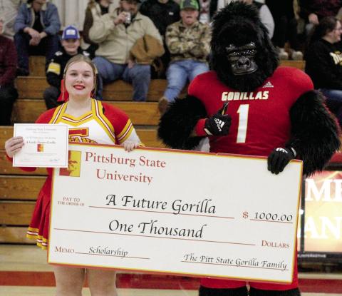 Pittsburg State University mascot Gus Gorilla recently traveled to Columbus to present Bre Reedy with a $1,000 academic scholarship.