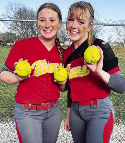 Lady Titan Juniors, Kaitlynn (KT) Lopp and Graci Major, collected their home run balls following their season opener on the road in Altamont. Lopp knocked two dingers over the fence and Major hit one over to help Columbus in their 17-1 win over the Lady Grizzlies, Monday. Courtesy Photo.