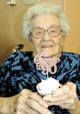 Shirley Grant shows one of the cupcakes from her 90th birthday party. Family and friends joined her in honor of the occasion.