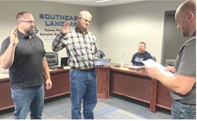 During a regularly scheduled school board meeting January 19, two newly elected Southeast USD 247 board members, Ray Huff and Darren Best, were administered the oath of office by Board Clerk, Dustin Wheeler. Courtesy photo.