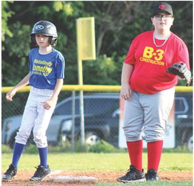 B-3 Construction’s third baseman, Ryker Saporito, holds the Natalini Automotive/ NAPA runner, Kalvin Davenport on base in the 10 and Under/Minor League game at Volunteer Field, Wednesday. ( Courtesy photo.)