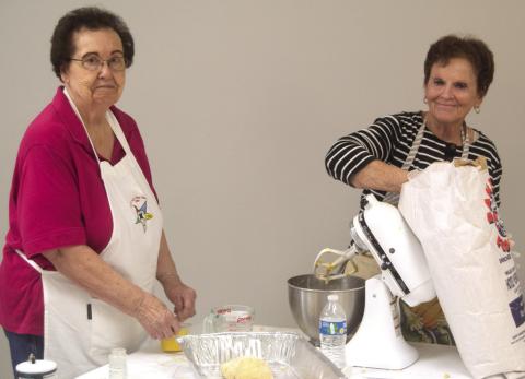 Each of the Mercy Auxiliary members had a task when they recently gathered to make noodles for a fundraiser. Ladonna Smith was rolling dough and Ann Thiele was measuring flour. Columbus News Report photo by Shawn Churchill.