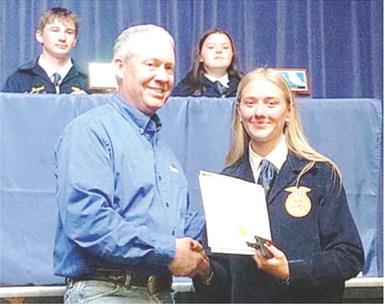 Southeast FFA senior, Kendyl Renn, was presented the FFA senior appreciation award from Dr. Kurtis Gregory, Cherokee County Farm Bureau representative at a recent ceremony. Courtesy photo.