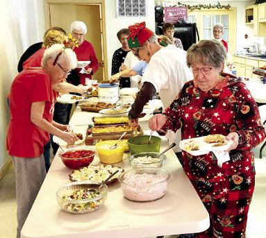 A potluck dinner and pajamas were on tap for the December 12 Bunco games. The players celebrated the Christmas season with food, fun and friendship.