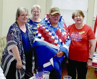 A Quilt of Valor was presented to Thomas Mounce of Miami, Okla., by Creating Quilts of Valor. at the monthly meeting of the Baxter Springs American Legion Post 206 September 13. Mounce served in the Army from 1969-1989, with duty stations including Vietnam, three tours Germany, and Fort Sill and Fort Hood. Courtesy photo.