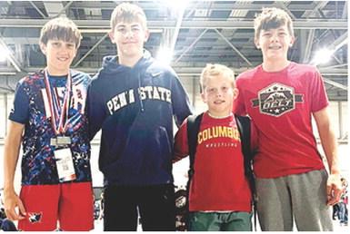 Titan Wrestlers Briggs Johnson, Blaze Bowman, Baylor Bowman, and Cam Carter were part of the Titan Team that participated in the Kansas State Freestyle/ Greco Wrestling in Topeka early in May. They all finished in the top five at the best-of-the-best tournament. Courtesy photo.