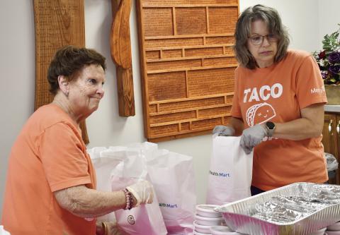 Ann Thiele and Melissa Torchia were packing orders for the Mercy Auxiliary Taco fundraiser. Funds will be used toward an inhouse 3D mammography machine. Photos on this page by Tanya Woolsey.