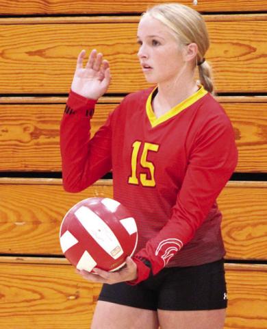 Lady Titan Landry Perry serves in the C game, Thursday at the CUHS Gymnasium.