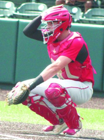 Columbus 2023 Graduate, Landin Midgett, signals his teammates from behind home plate in the Kansas Class 3A State Championship Quarterfinal win over Kansas City-Bishop Ward, May 25, at Kansas State University’s Tointon Family Stadium.