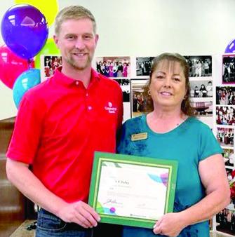 Wade Schossow presented Sonja Duley a certificat in recognition of her 40 years with Commerce Bank at a reception Friday. Courtesy photo.