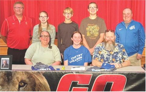 Lady Lion Chloe Hall has signed a National Letter of Intent to play golf at Cottey College as she takes her skills on the links to the next level. Chloe’s golf coach Art Roberts, and siblings Hanna Hall, Jace Hall, and Joseph Hall, and Cottey Coach Dom joined their parents, Amanda Hall, Chloe, and Travis Hall for the signing at the Baxter Springs High School Auditorium following the girls season last October. Courtesy photo.