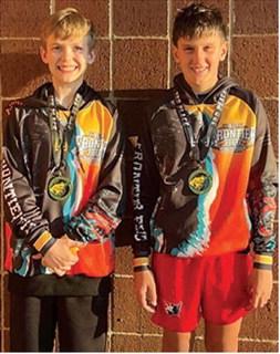 Lucas Natalini and Briggs Johnson, local mini wrestlers came away from the Bobcat Classic with third place and second place hardware, Saturday, in Basehor. Courtesy photo.