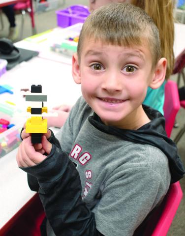 USD 493 students at Park Elementary took part in a number of activities related to the recent celebration of Kansas Day. Rowan Benedict shows off his interpretation of the Kansas State Salamander.