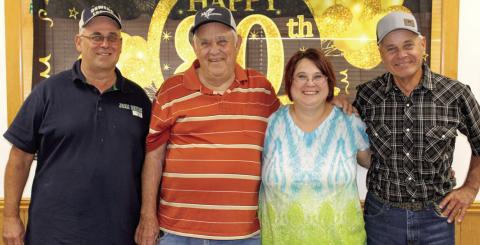 Lyman Crain (second from left) recently celebrated his 80th birthday. His children John Crain, Julie Thomas and Tim Crain hosted the party at the 4-H Building. Family and friends joined in the celebration.