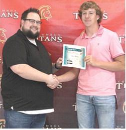 Kyler Rahmeier received the First Christian Church Scholarship in the amount of $500 from FCC Pastor, Cody Bohall, during the 2025 Columbus Unified High School Senior Assembly, May 16, at the CUHS Gymnasium.