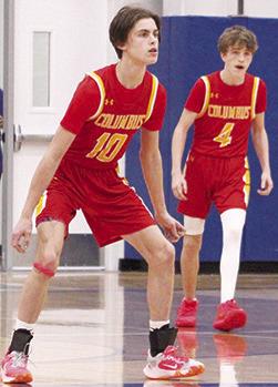 Titan Senior, Derek Krause, and sophomore, Cooper Bush, set up for defense in the final minutes of the Kansas Class 3A Sub-State quarterfinal loss to the Rams in Riverton, 47-69, Monday. Columbus ended their season with a 5-15 record. Riverton advanced to play Frontenac last night at Caney Valley High School. Scores were not available at press time.