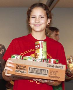 Columbus LEO Club helps assemble Thanksgiving food boxes