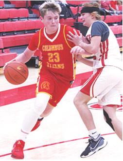 Jex Cheney drives to the basket past Baxter Springs defender, Caster Herrera, in the Monday loss on the road, 20-28. Cheney led the Titan Eighth Grade Team with eight points.