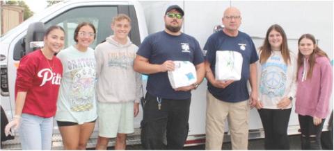 Cherokee County Ambulance personnel Kyle Darnell and Les Flood stopped by the Veterans and First Responder Appreciation Dinner Monday, September 11. Presley Tedlock, Katy Mooney, Korbyn Newberry, Jaiden Campbell and Britney Degonia assisted with assembling and passing out meals during the event.