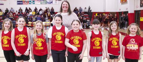 Members of the Columbus Recreation Commission’s Lady Titan League were introduced during the CUHS Basketball game with Girard in February. Members of the third grade Lady Titan Team are Willow Patton, Peyton Hayes, Teagan Jarrett, Wren Ellis, Andi Parsons, Hadley Bessman, and Mariah Moser. Teammates not pictured are Carrie Mooreman, Hayven Griffoth, and Shay Neely. The team is coached by Anna Moser, above. Lance Moser and Vanessa Jarrett also coached the team. Morgan Moser served as assistant coach.