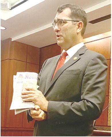 Even politicians in Washington carry something worth reading. Congressman Derek Schmidt had a copy of the recent issue of the News-Report. He said he was particularly interested in the news story about local beef being electrocuted by high power electric lines. Courtesy photo.