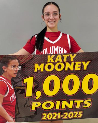 Columbus Lady Titan Senior, Katy Mooney, reached 1,000 career points in the win at Baxter Springs, Monday. Katy needed ten points going in to the game and picked up the record breaker at the end of the first half. She tallied 20 points for the game.