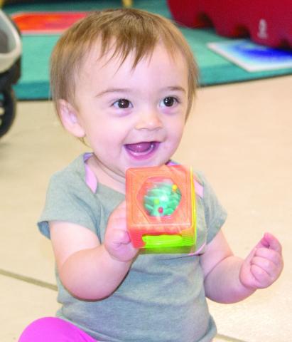 The recent Storytime at the Columbus Public Library was all about rain. Isidora Maple is full of smiles exploring the toys during the event. Storytime events are held each month for children under five. Children can work on an art project while listening to a story on the month’s topic before exploring the many toys available. News Report photo by Tanya Woolsey.