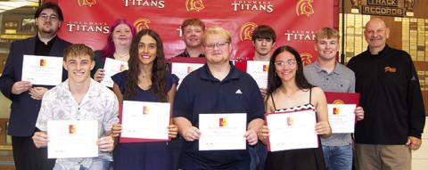CUHS Seniors receiving scholarships from Pittsburg State University are front row: Korbyn Newberry, Brylie Johnson, Maddox Ochsner, and Katy Mooney. Back row: Robert Graham III, Ashlyn Ash, Kanyen Smith, Lydon Lovesee, and Syler Schuberger. David Hogard, PSU Representative presented the scholarships.