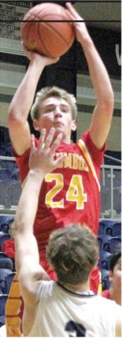 Columbus Titan Sophomore, Kooper Saiz, shoots for two points over Galena Senior, Jack Perry, in the Class 3A Quarterfinal loss in Galena, Friday, 42-75.