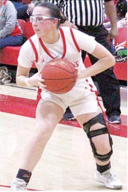 Lady Titan Senior, Torey Tedlock, looks to pass in a recent home game. Torey had six points in Tuesday’s loss to New Heights in the Lancer Classic.