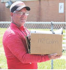Columbus Elementary School Physical Education Coach, Heath Perry, had his hands full with the All-School Elementary Track and Field Meet Friday at Central School. Students in K-6 and teachers competed in various events from 9:30 a.m. to 2:30 p.m.
