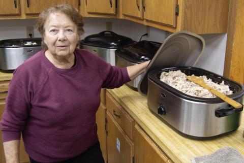 At the annual Community Christmas Dinner Virginia Leake was in charge of placing the turkey on all of the orders. The event had a large turnout and everyone had a nice selection of dishes for their meal.