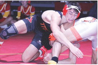 Titan Junior, Jayden Rodriguez, works to pin Kaeson Lewis, Independence, during the home team’s dual win, Tuesday, at the CUHS Gymnasium.