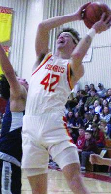 Titan Senior, Seth Stover, goes to the basket over Galena Senior, Ty Hall, in the 40-29, Bulldog win in Columbus, Friday.