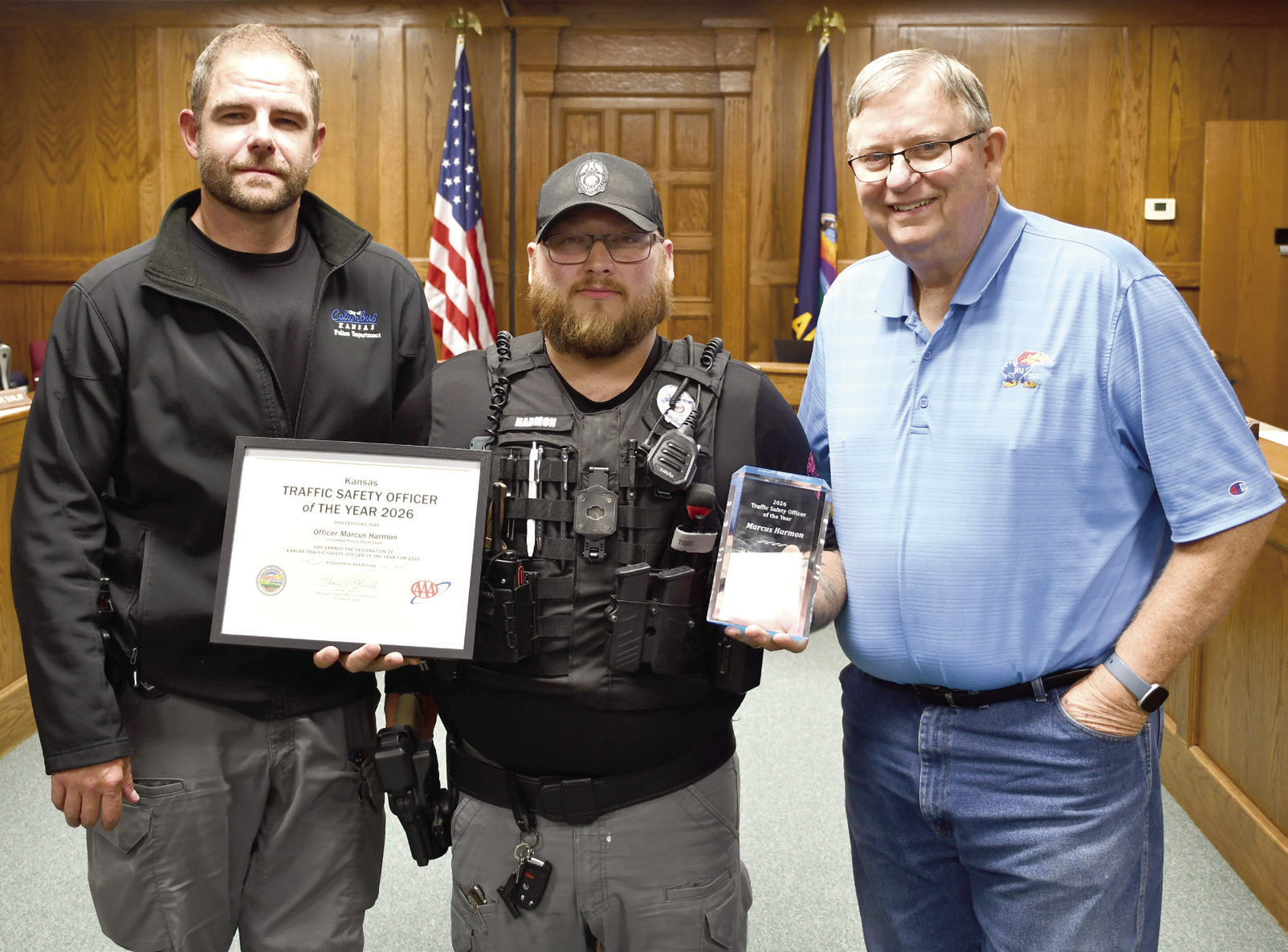 Officer Marcus Harmon, center, stands with Columbus Police Chief Kyle Clark, left, and Columbus Mayor Grant Spieth, right. He is the first recipient of the Kansas Traffic Safety Officer of the Year award presented at the Annual Impaired Driving Conference held in Wichita October 5 and 6.